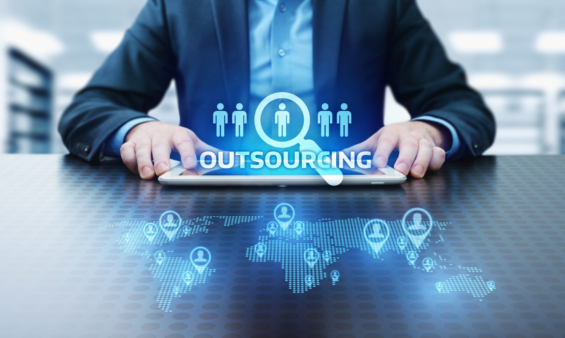 Businessman analyzing HR outsourcing strategy using digital tools, symbolizing the role of leading HR outsourcing companies in Dubai & UAE.