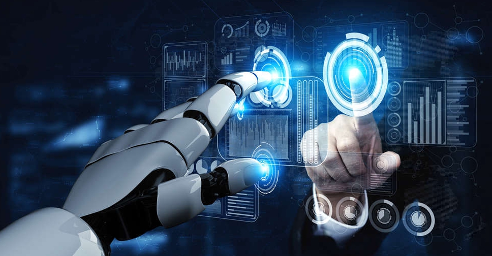 A robotic hand and a human hand interacting with a futuristic digital interface, symbolizing AI payroll UAE and automation in payroll management.