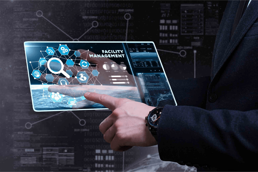 Businessman interacting with digital interface displaying facility management dashboard, symbolizing the use of the Best Payroll Software in UAE.