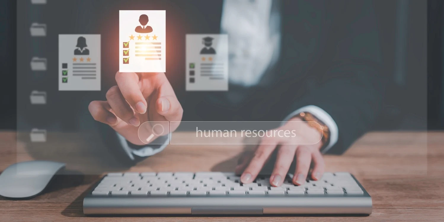 Business professional using HR software in UAE to select candidates through a digital human resources interface.