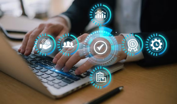Business professional using a laptop with floating icons representing HR functions like payroll, recruitment, and compliance — concept of HRMS Software.
