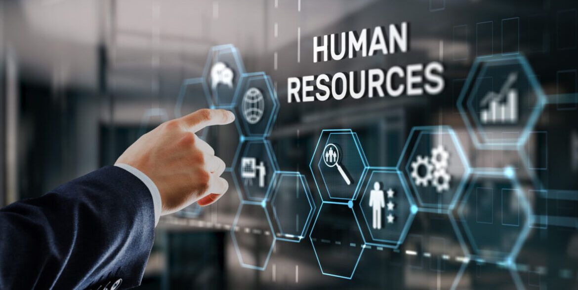 Person interacting with digital interface displaying human resources icons, symbolizing modern HR software solutions for workforce management