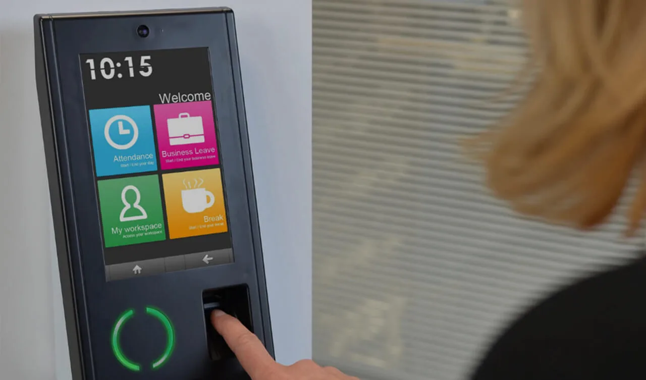 Employee using biometric device with employee attendance software in Pakistan